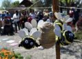 A bee mobile hangs in the children's garden in the La Loma Native Garden during the first Modesto Pollinator Festival in 2019.