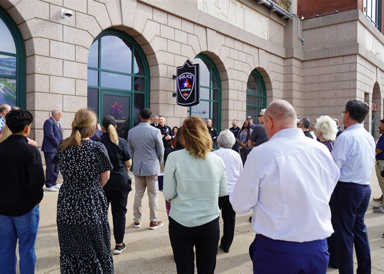 A crowd gathered in front of the new APD Entertainment District storefront