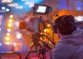 a camera and cameraman filming a scene on set using Autodesk Flow
