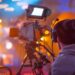 a camera and cameraman filming a scene on set using Autodesk Flow
