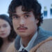 Austin (Charles Melton) looks ahead, as Ashley (Cailee Spaeney) looks to the side on Beef.