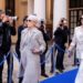 Meryl Streep and Anne Hathaway walk past photographers in a scene from The Devil Wears Prada 2.