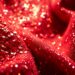 An extreme, abstract close-up photograph showcasing the luxurious and captivating textures of the music industry, such as glittering sequins and shattered disco glass, captured in a high-contrast, high-fashion style.