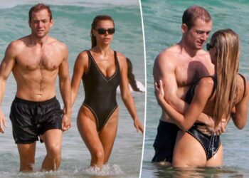 Brooks Nader and Taron Egerton take a dip during romantic Australia beach date