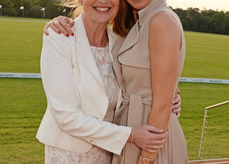 A photo of Carol Kirkwood and Sally Nugent hugging