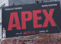 Charlize Thereon stands beside 'Apex' billboard in Times SquareCredit: Aeon/GC Images