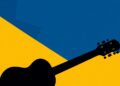 A striking abstract composition of jagged, geometric shapes in deep blue and bright yellow, conveying the idea of preserving the legacy of country music while championing its future.