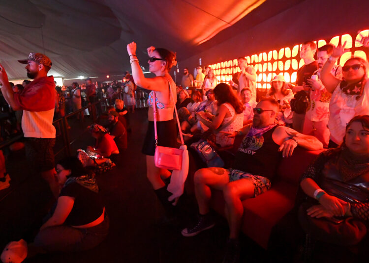 Music fans enjoy an afternoon performance in the air-conditioned Sonora...