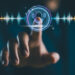 Voice recording. Man touching microphone icon on smartphone. Mobile application record sound, audio, music, voice message or use your voice to direct AI to search for information on Internet.