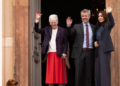 Queen Margrethe waves with King Frederik and Queen Mary