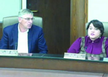 Councilmember Robert Bruce listens to Councilmember Helen Grant discuss personal liability and possible litigation at Norman's Tuesday City Council meeting. (Screenshot/Sam Royka)