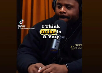 A man in a blue beanie and black hoodie speaks into a microphone on a podcast. Text reads, "I think Drake is a very."