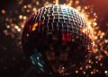 An abstract close-up photograph of shattered disco ball fragments reflecting bright, high-contrast light, evoking the glamour and energy of 80s pop music.