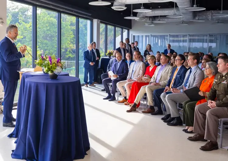 Michael Berkowitz, executive director of the Climate Resilience Institute, welcomes the royal couple to the Rosenstiel School.