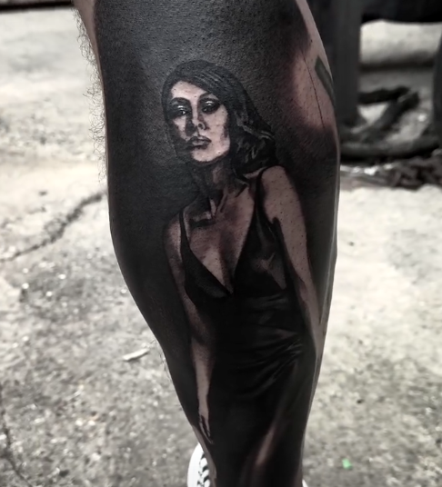 A photo of a tattoo of a woman