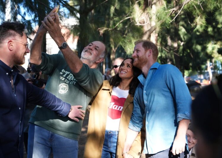 The Duke and Duchess of Sussex pose for a selfie at the Scar Tree Walk in Melbourne (PA)
