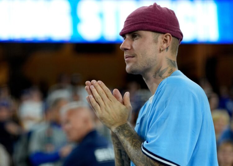 Singer Justin Bieber watches the Los Angeles Dodgers and the Toronto Blue Jays during the seventh inning in Game 3 of baseball's World Series, Monday, Oct. 27, 2025, in Los Angeles. THE CANADIAN PRESS/AP-Ashley Landis