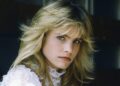 Jennifer Runyon wears white lace blouse