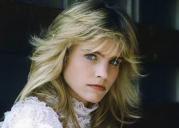 Jennifer Runyon wears white lace blouse