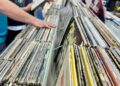 (Photo by Zant Reyez/Staff Reporter) Hands browse through records at Downtown Sound Records and Tapes in downtown Greeley Saturday, April 12, 2025, for Record Store Day. The day was created in 2008 to help local record stores bring in more traffic. There are special releases, along with store owners stocking up for the day with more inventory.