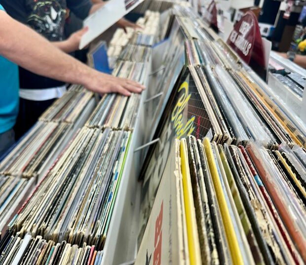 (Photo by Zant Reyez/Staff Reporter) Hands browse through records at Downtown Sound Records and Tapes in downtown Greeley Saturday, April 12, 2025, for Record Store Day. The day was created in 2008 to help local record stores bring in more traffic. There are special releases, along with store owners stocking up for the day with more inventory.