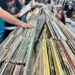 (Photo by Zant Reyez/Staff Reporter) Hands browse through records at Downtown Sound Records and Tapes in downtown Greeley Saturday, April 12, 2025, for Record Store Day. The day was created in 2008 to help local record stores bring in more traffic. There are special releases, along with store owners stocking up for the day with more inventory.