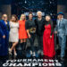 Host Guy Fieri and winning contestant Antonia Lofaso with Hunter Fieri, Tiffani Faison, Maneet Chauhan, Brooke Williamson, Mei Lin, Simon Majumdar, and Justin Warner, as seen on Tournament of Champions, Season 6, Food Network, 2025.