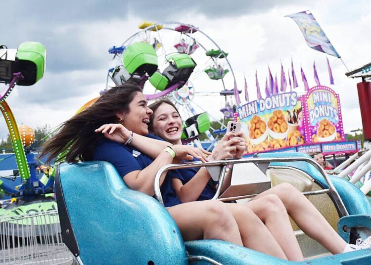 The Family Fest midway, by Shooting Star Amusements, features rides and games. (The News files)