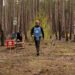 Britain's Prince Harry, the Duke of Sussex, walks in a forest as he visits members of the HALO Trust (Hazardous Area Life-support Organization), a non-commercial charity organisation for demining