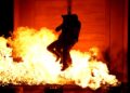 Contestants near flames during an episode of "Fear Factor"