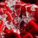 An extreme, abstract close-up photograph of shattered glass and crumpled velvet textures in high-contrast studio lighting, conceptually representing the fragility and impermanence of life.
