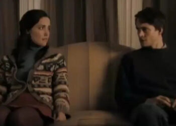 Rose Byrne and Hugh Dancy sitting slightly apart from each other in Adam.