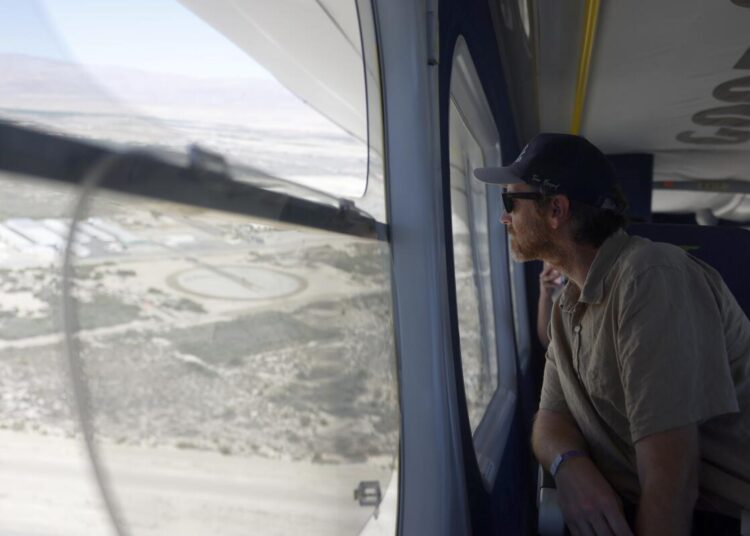 Los Angeles Times reporter Mikael Wood rides the Goodyear blimp flying over Coachella