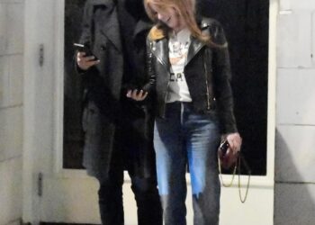 Isla Fisher getting cosy with former South African footballer Larry Cohen.