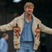 Ryan Gosling in his Fox sweater with his arms out wide in Project Hail Mary