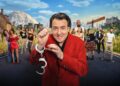 Six pairs stood either side of a super imposed Jonathan Ross, who is wearing a red suit with a set of handcuffs hanging from his hand.
