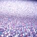 An extreme close-up photograph of shimmering, glittering sequins in dramatic, high-contrast studio lighting, conceptually representing the glamour and spectacle of red carpet events.