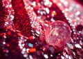 An extreme close-up photograph of sparkling sequins and shattered glass, capturing the luxurious textures and high-energy glamour of Coachella festival fashion.