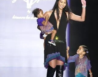 Kimora Lee Simmons and her daughters during Mercedes-Benz Fashion Week Spring 2004 - Baby Phat - Runway at Gertrude Tent, Bryant Park in New York CityCredit: Djamilla Rosa Cochran/WireImage