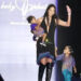 Kimora Lee Simmons and her daughters during Mercedes-Benz Fashion Week Spring 2004 - Baby Phat - Runway at Gertrude Tent, Bryant Park in New York CityCredit: Djamilla Rosa Cochran/WireImage
