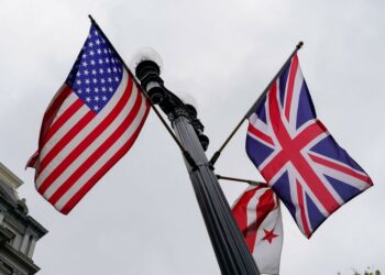 U.S., Union Jack, and Washington, D.C., flags fly in the wind near the White House ahead of Britain’s King Charles and Queen Camilla’s visit to the United States