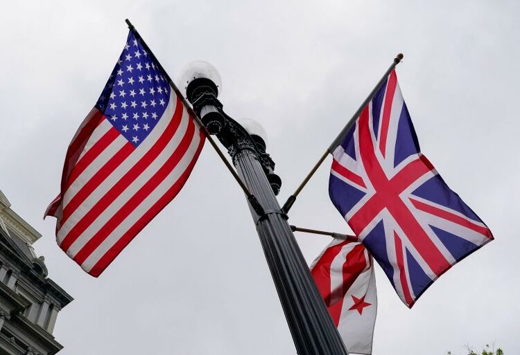 U.S., Union Jack, and Washington, D.C., flags fly in the wind near the White House ahead of Britain’s King Charles and Queen Camilla’s visit to the United States