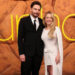Euphoria creator Sam Levinson and actress Sydney Sweeney (right) attending the LA premiere for the new series earlier this week. He is wearing a black suit and tie and she is wearing a white dress.
