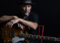 Paul Thorn singer songwriter portrait with guitar