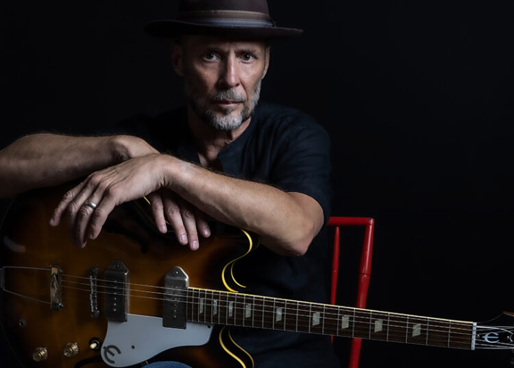 Paul Thorn singer songwriter portrait with guitar