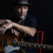 Paul Thorn singer songwriter portrait with guitar