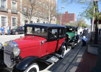 Two Model A Fords are parked outside the Joliet Area Historical Museum as their owners start on the Route 66 Red Carpet Corridor Festival on Saturday, May 7, 2022.