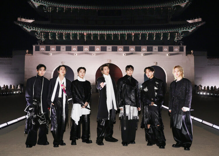 Boy band BTS poses for a photo in front of Gwanghwamun gate in central Seoul during its March 21 performance in the area, marking its fifth full-length album "Arirang." [BIGHIT MUSIC/NETFLIX]