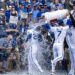 Kansas City Royals center fielder Kyle Isbel (28) is doused by shortstop Bobby Witt Jr. (7) and catcher Salvador Perez (13) after winning 3-1 for for an home opening game against the Minnesota Twins at Kauffman Stadium on Monday, March 30, 2026, in Kansas City.