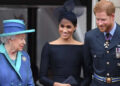 Queen Elizabeth II, Meghan Markle and Prince Harry watch the RAF100 flypast in 2018. By: James Whatling/MEGA